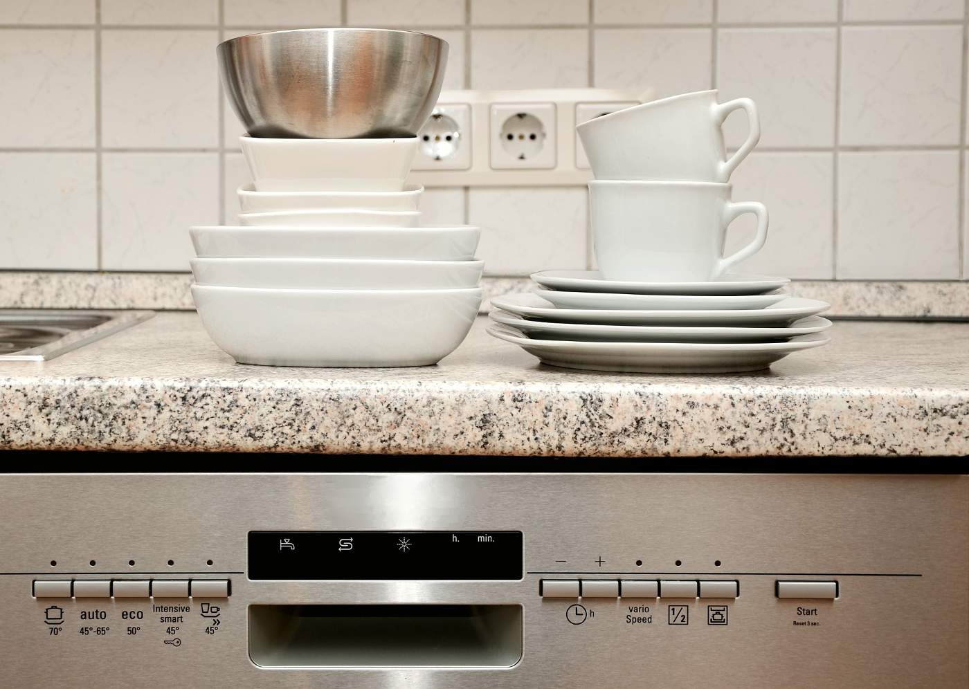 Dishes on top of a dishwasher - How to Soundproof a Dishwasher in 8 Effortless Steps 