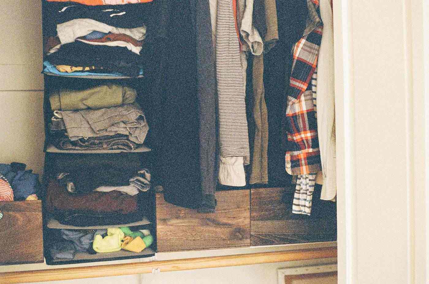 Open closet with racks and clothes